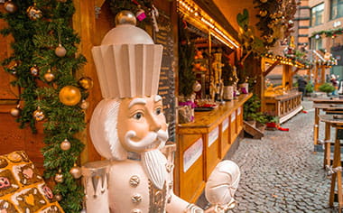 A white Nutcracker statue at Bonn Christmas Market